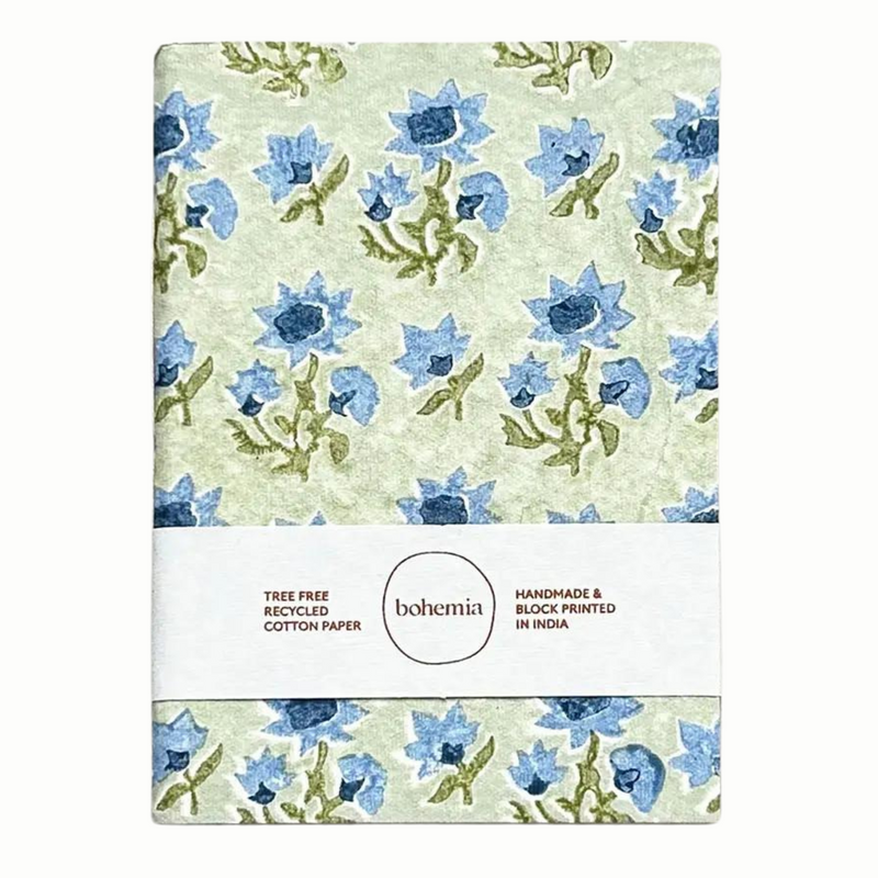 A cotton paper notebook with a vintage blue and green floral design.