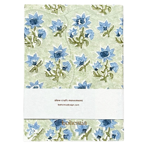 A cotton paper notebook with a vintage blue and green floral design.