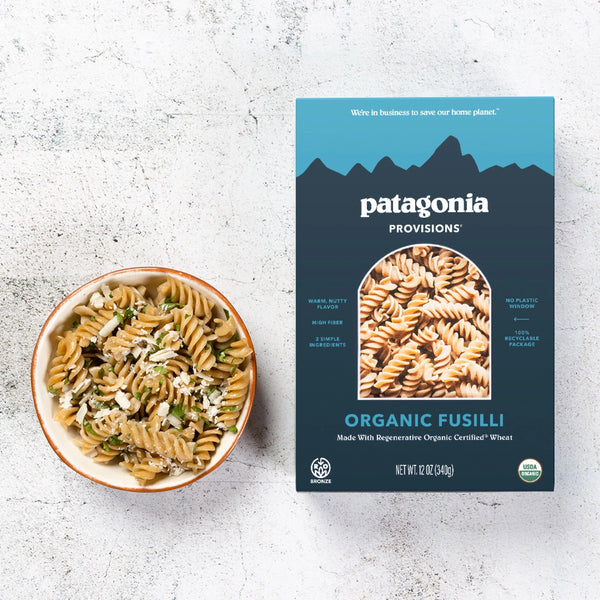 box of organic fusilli pasta with bowl of pasta