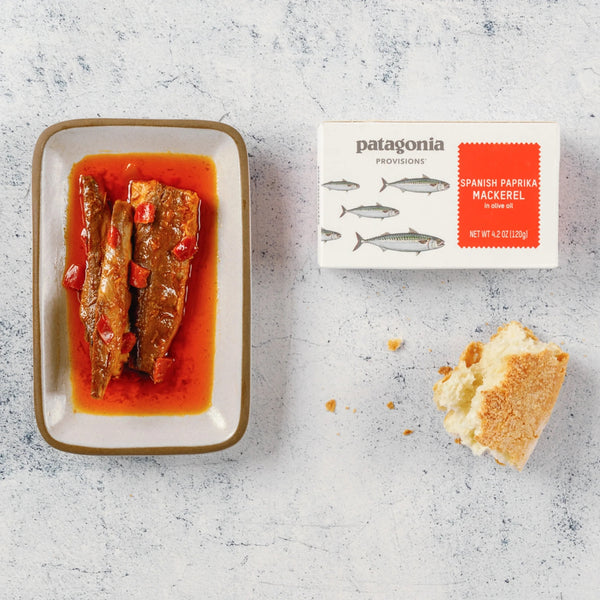 tin of spanish paprika mackerel crackers with dish of mackerel