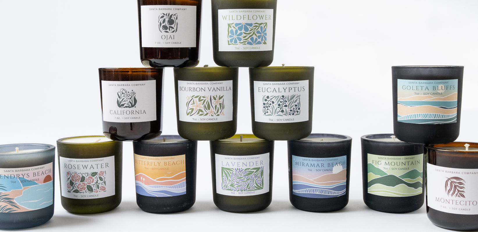 santa barbara company candles stacked and displayed. fragrances including ojai, santa barbara, butterfly beach, montecito and more.