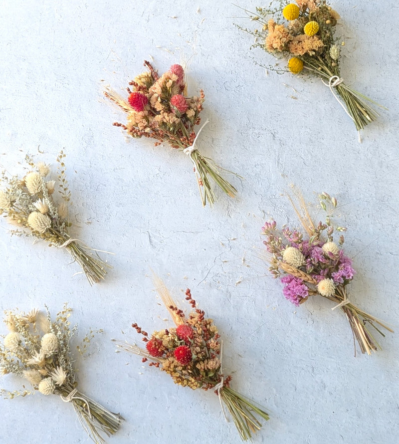 dried floral arrangements pictured on a table