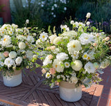 Two large white flower arrangements