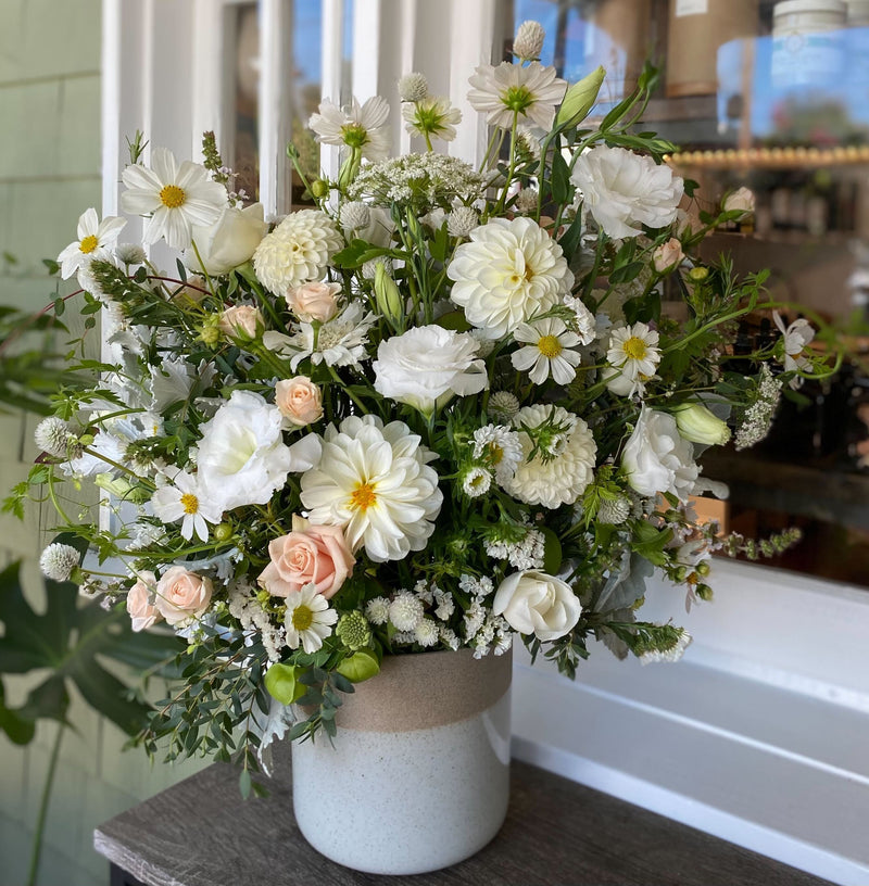 Extra Large White Flower Arrangement featuring dahlias, lisianthus, roses, ammi, cosmos, and more. 